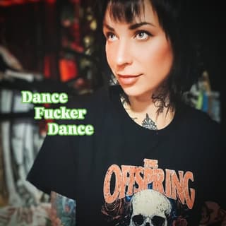 Person wearing black Offspring band shirt displaying a shoulder tattoo of a skull with decorative elements in dark ink.