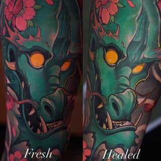 Side-by-side comparison of a green skull with orange eyes and red flowers, shown fresh and healed stages on an arm.