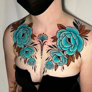 Turquoise blooming flowers with rust-colored leaves and black linework arranged symmetrically across the chest, centered at the sternum.