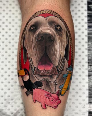 Dog's head portrait with rope border and colorful toys including a toucan, pig, and duck on the lower leg.