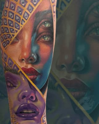 Colorful portrait tattoo on arm featuring a woman's face with striking green eyes, geometric patterned headwrap in gold and purple, vibrant gradient background.