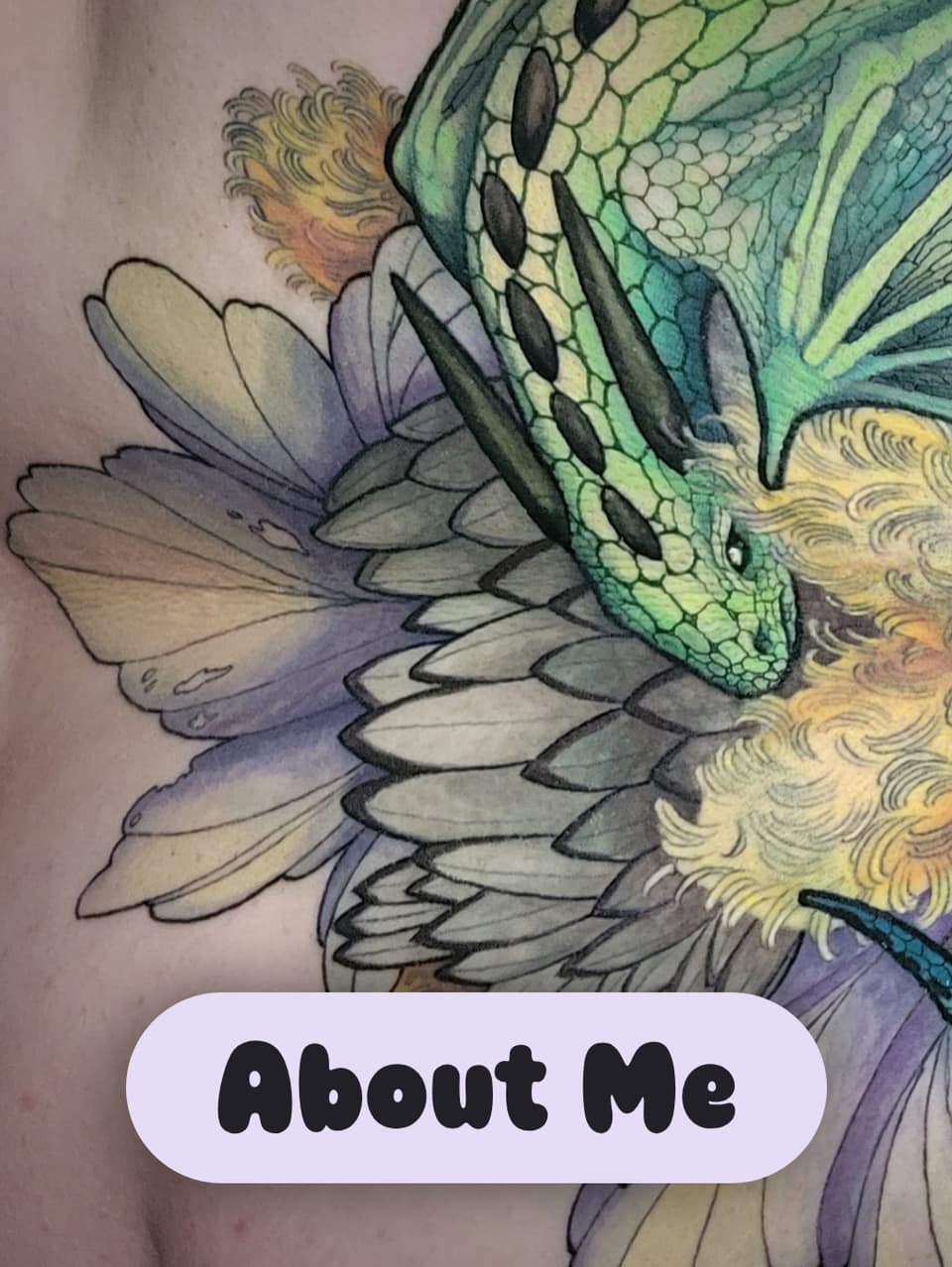 Colorful dragon head tattoo with green scales, gold and purple mane, and detailed wing feathers in yellow, green, and lavender tones.