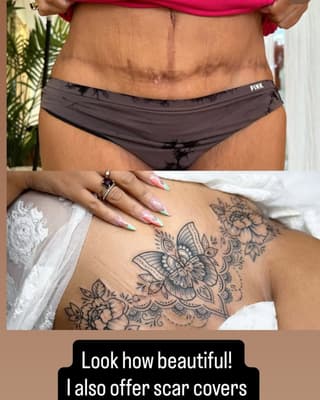 Intricate floral and butterfly tattoo in black ink on shoulder and upper back, displayed on tan skin with manicured nails visible.