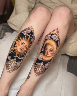 Two matching arm tattoos featuring celestial-themed portrait faces in ornate frames with gold decorative borders and black backgrounds on pale skin.