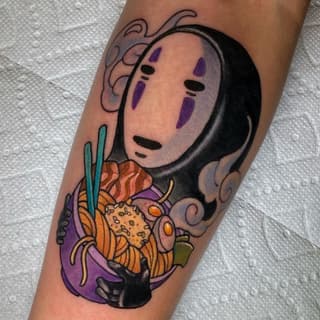 Colorful tattoo on a calf featuring a masked character with purple markings holding flowers and organic elements in orange, yellow, and green hues.
