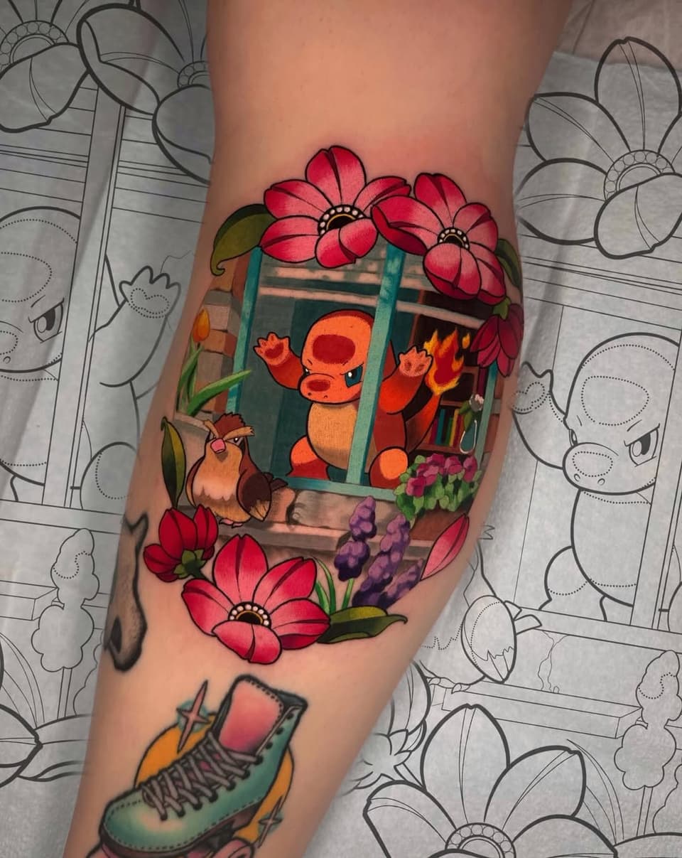 Colorful leg tattoo featuring a window with an orange character, pink flowers, a brown bird, purple grapes, and a green boot with laces.