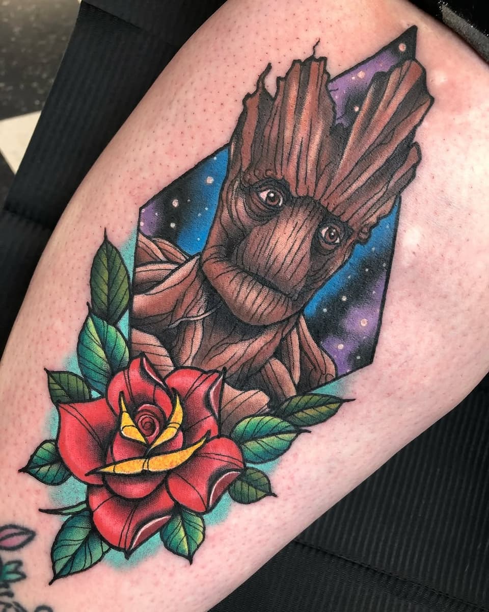 Groot character with expressive eyes holding a red rose with yellow center and green leaves, set against a cosmic purple and blue background on an arm.