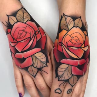 Two matching rose tattoos with green leaves on the backs of hands, featuring red and orange gradient petals with black outlines and shading.