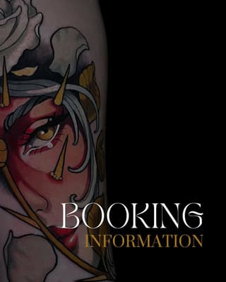 Colorful demon face tattoo on upper arm featuring red skin, golden horns, gray hair, and intricate facial details in red, gold, black, and purple tones.