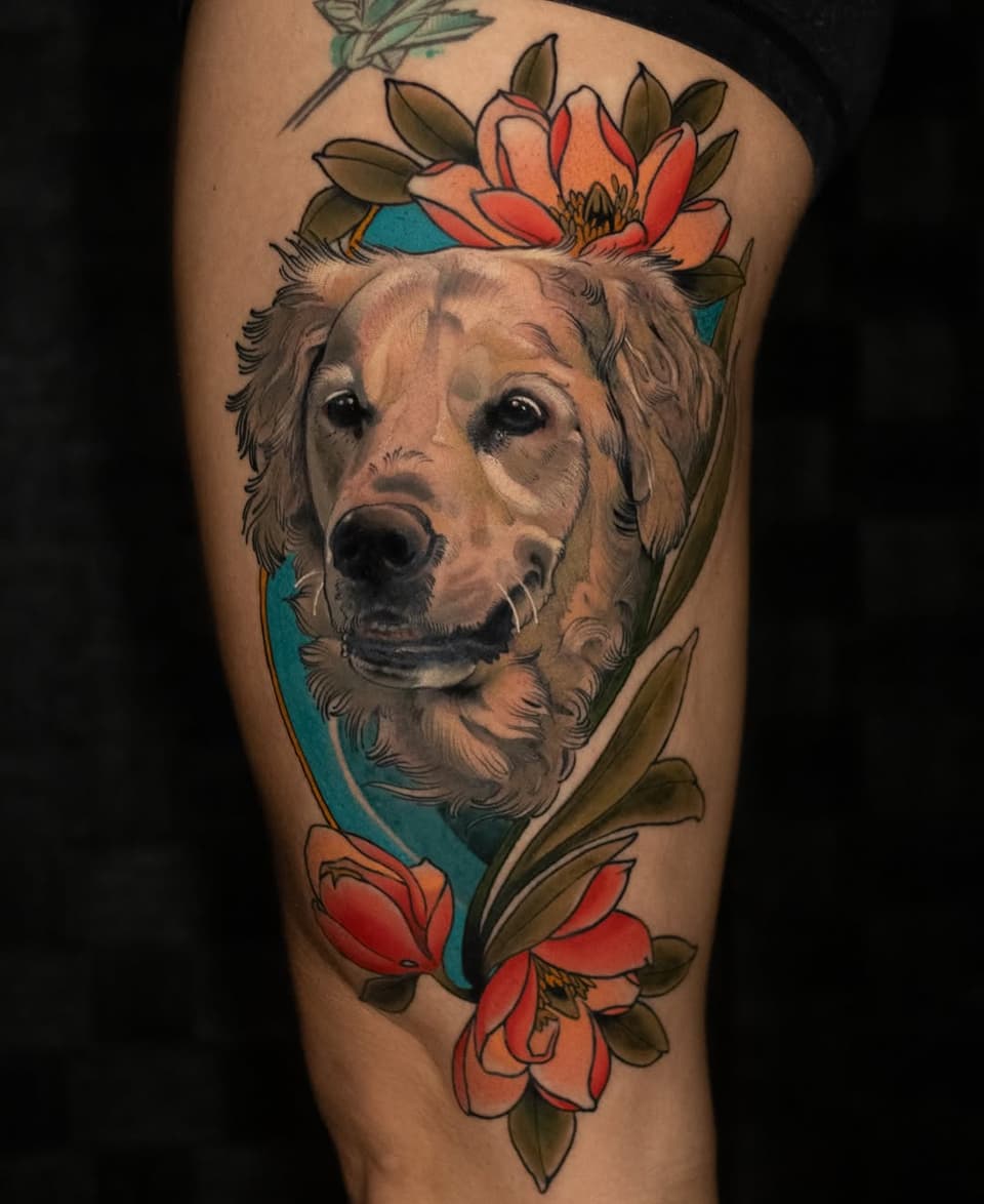 Dog's head portrait surrounded by red and orange flowers with green leaves on a blue background, tattooed on thigh.