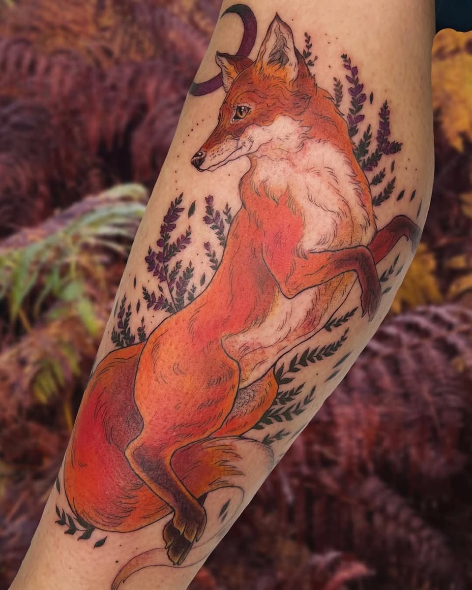 A reddish-orange fox with white chest stands on hind legs on an arm, surrounded by purple lavender sprigs and a crescent moon above.