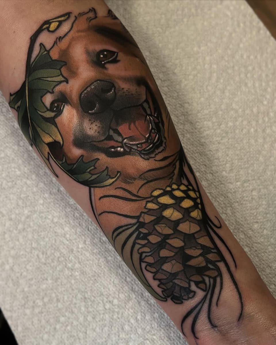 Colored koi fish tattoo on the forearm featuring detailed scales in gold and bronze tones with black outlines and shading.