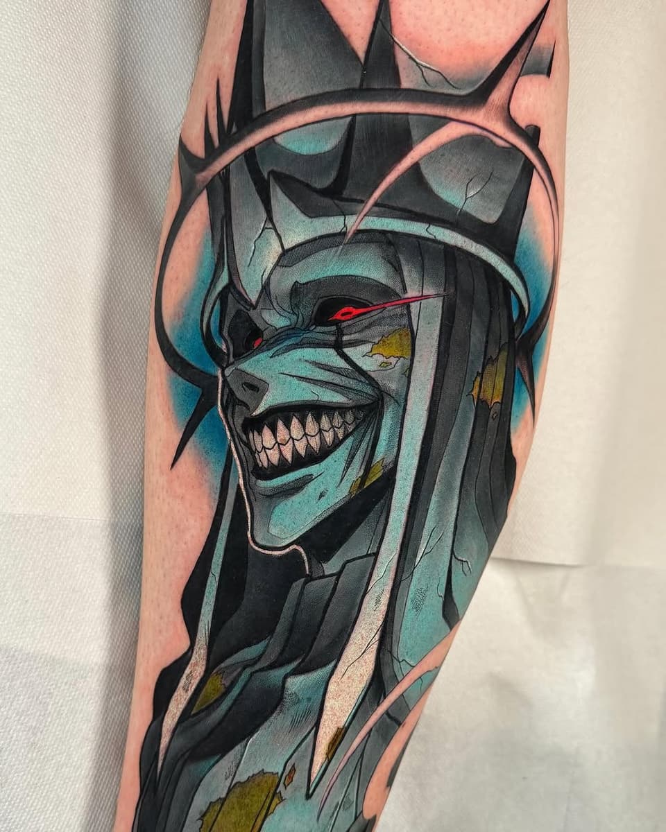 Skull with teal and black coloring, red eyes, and gold accents wrapped around the upper leg and thigh area.