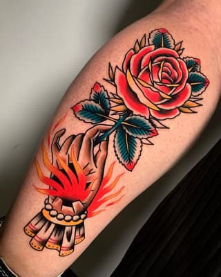 Red rose with teal leaves and an ornate hand holding flames below, rendered in red, orange, yellow, and teal on an arm.
