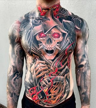 Large skull with glowing red eyes and black wings on chest, surrounded by red and orange flowing elements and skeletal hands on torso.