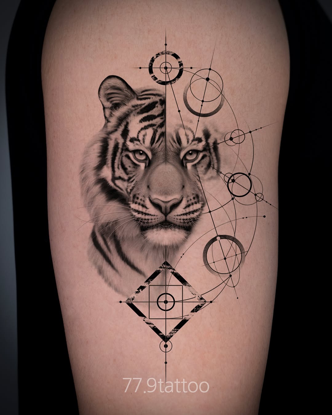 Photorealistic tiger head portrait with geometric sacred geometry line work overlay on thigh.